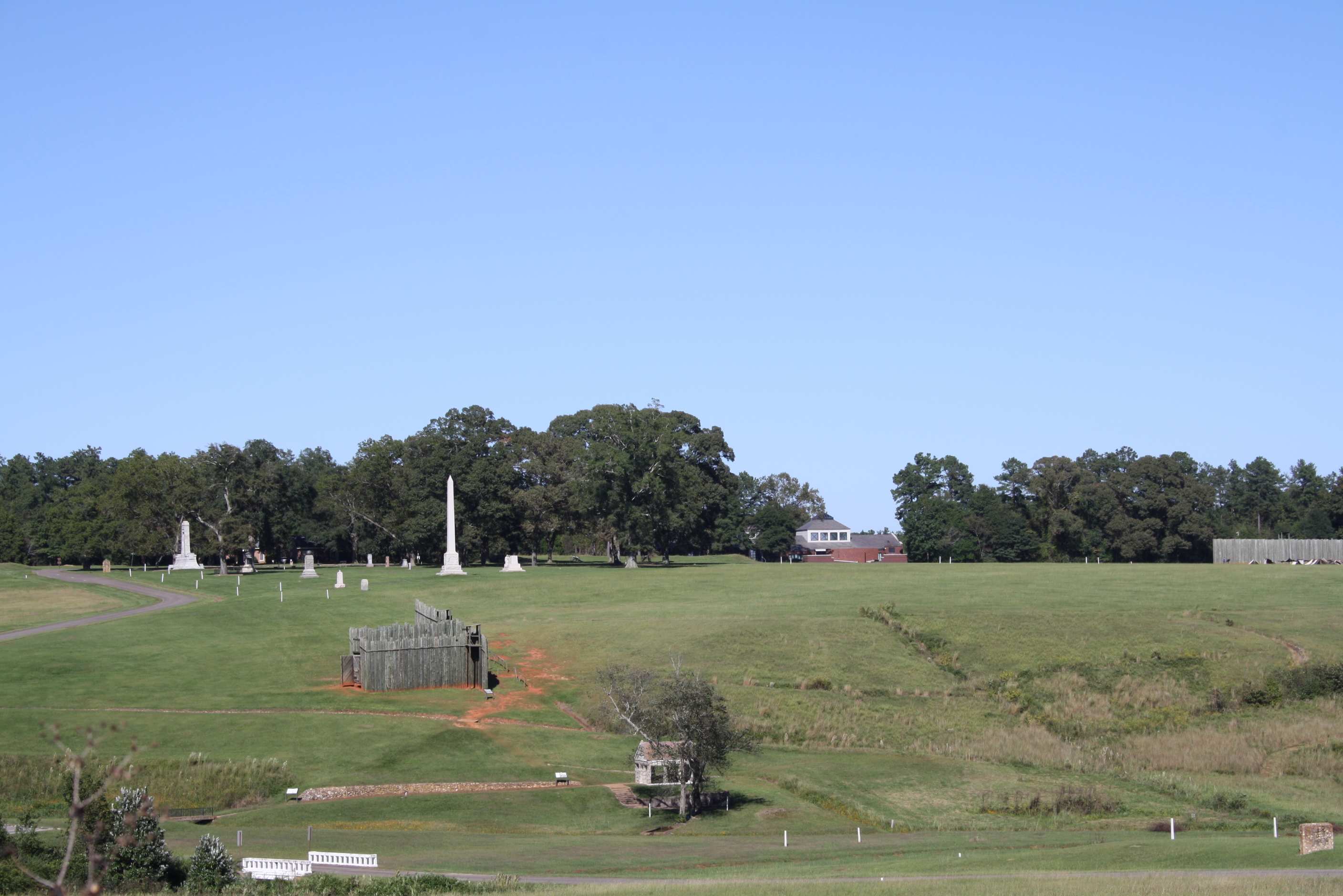 The prison site at Andersonville is adjacent to the National Prisoner of War Museum (shown in the background) and about one-third of a mile from the national cemetery (not shown). Andersonville National Historic Site 